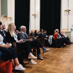 Audience listening to a presentation