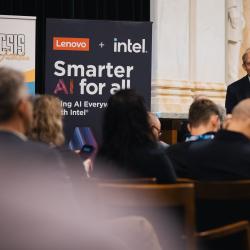 Person behind a podium, giving a presentation