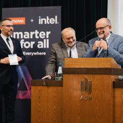 People behind a podium, giving a presentation