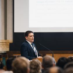 Person giving a presentation in an auditorium