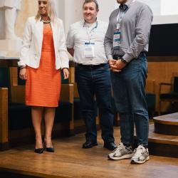 People on stage, in an auditorium