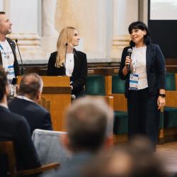People giving a presentation in an auditorium