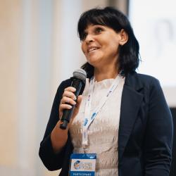 Person speaking to a microphone