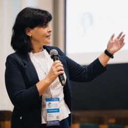 Person speaking to a microphone