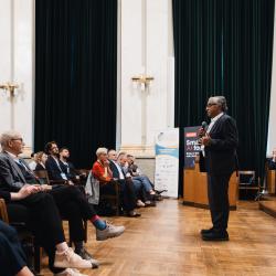 Person giving a presentation in an auditorium