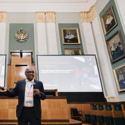 Person giving a presentation in an auditorium