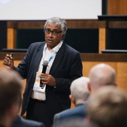 Person giving a presentation in an auditorium