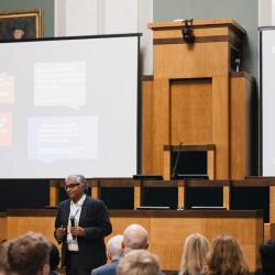 Person giving a presentation in an auditorium