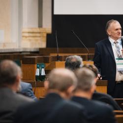 Person giving a presentation in an auditorium