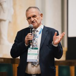 Person giving a presentation in an auditorium