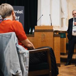Person giving a presentation in an auditorium