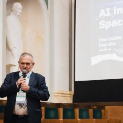 Person giving a presentation in an auditorium