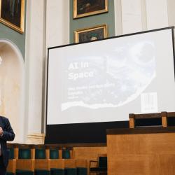 Person giving a presentation in an auditorium