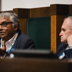 People behind a podium, talking