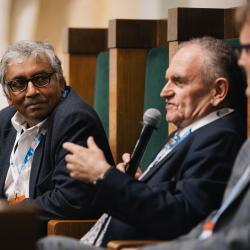 People behind a podium, talking