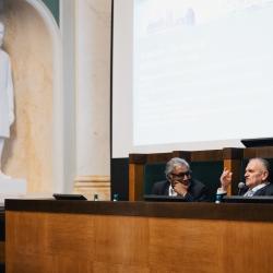 People behind a podium, talking