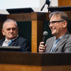 People behind a podium, talking
