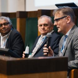 People behind a podium, talking