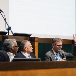 People behind a podium, talking