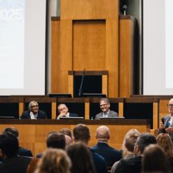 People behind a podium, talking