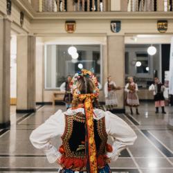 People in a building hall, looking down from the second floor