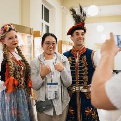 Person posing for a picture with dancers