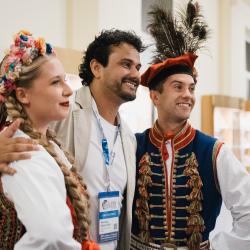 Person posing for a picture with dancers