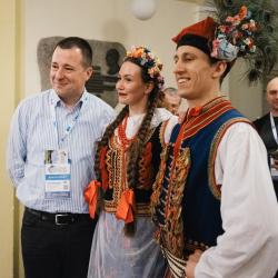 Person posing for a picture with dancers