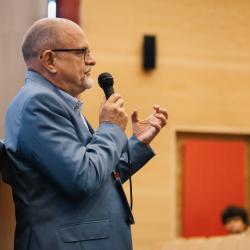 Person talking to a microphone