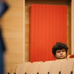 Person listening to a presentation