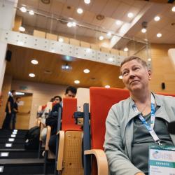 Person listening to a presentation