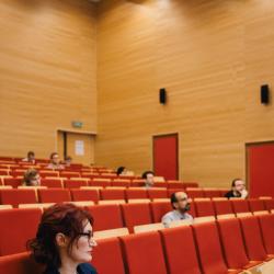 Person listening to a presentation