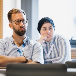 People listening to a presentation