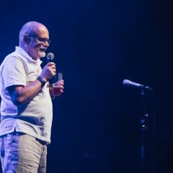 Person talking to a microphone