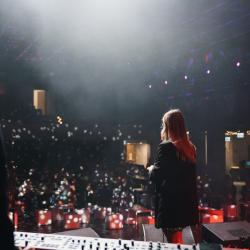 Music band on a dark stage, lit up by stage lights