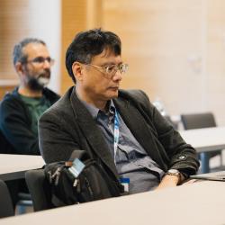 Person listening to a presentation