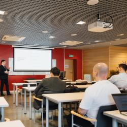 Person giving a presentation in a lecture room