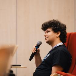 Person speaking to a microphone