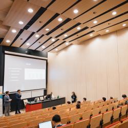 Person giving a presentation in a lecture room