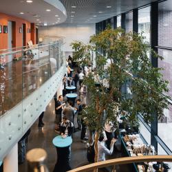People gathered in a hall with tables