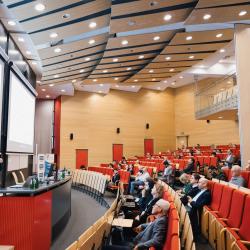Person giving a presentation in a lecture room
