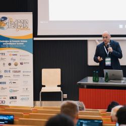 Person giving a presentation in a lecture room