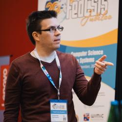 Person giving a presentation in a lecture room