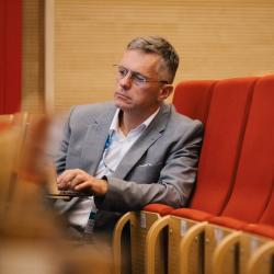 Person listening to a presentation