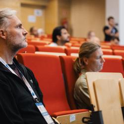 People listening to a presentation