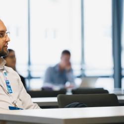 Person listening to a presentation