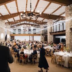 Banquet hall with people sitting at the tables