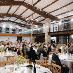 People sitting at the tables in a banquet hall