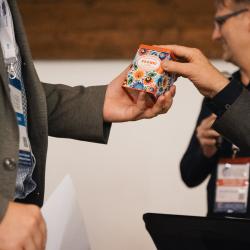 A person giving a gift to another person