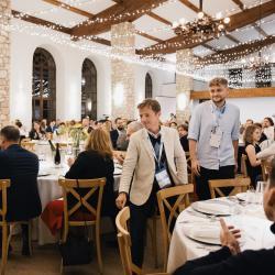People sitting at tables in a banquet hall